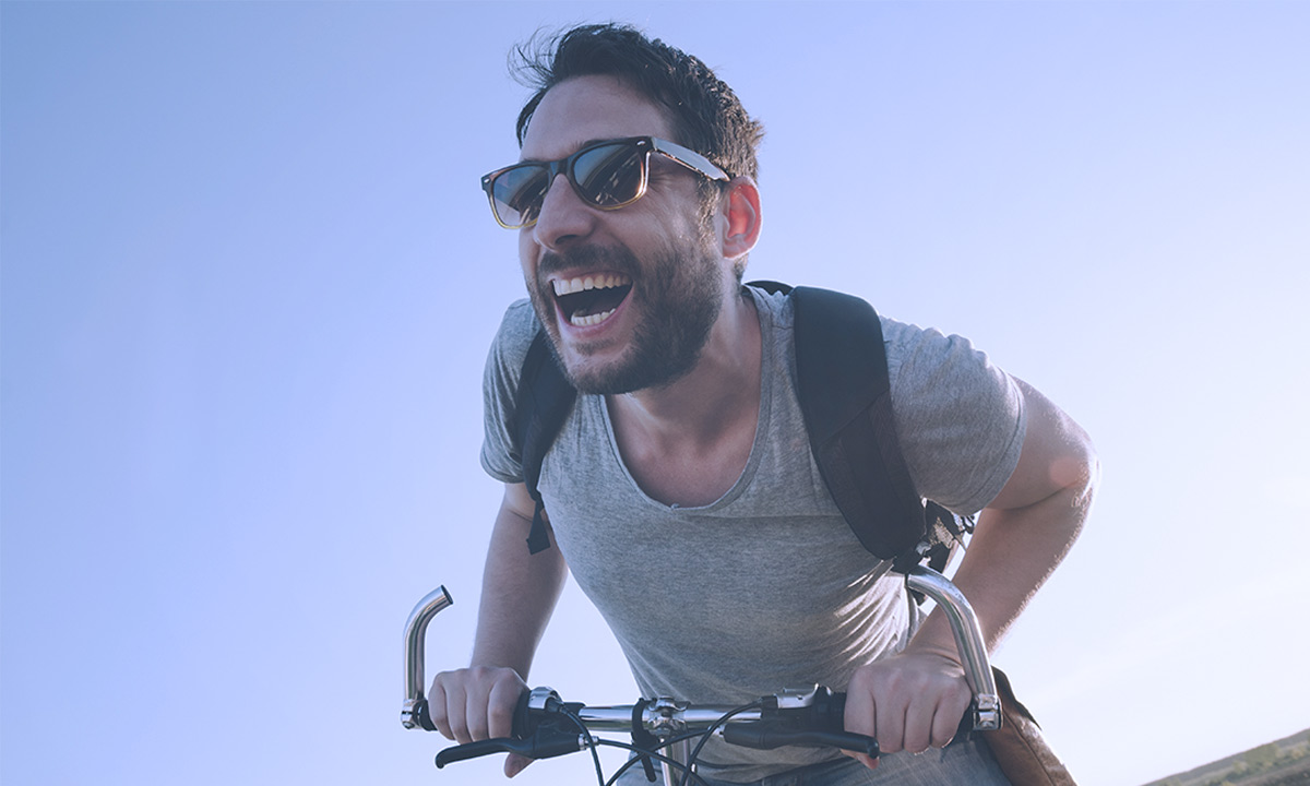 Guy on a Bike Smiling