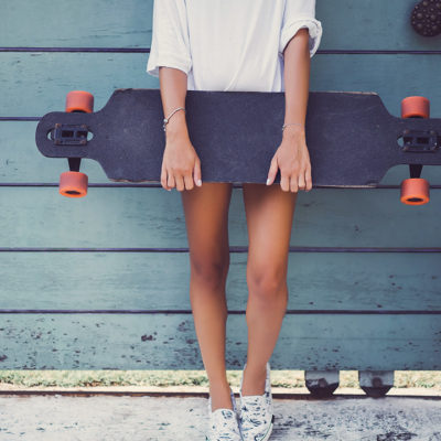 Girl Holding a Longboard