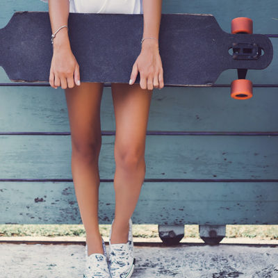 Girl Holding a Longboard