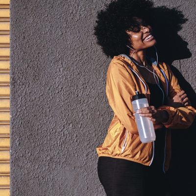 girl smiling with a water bottle