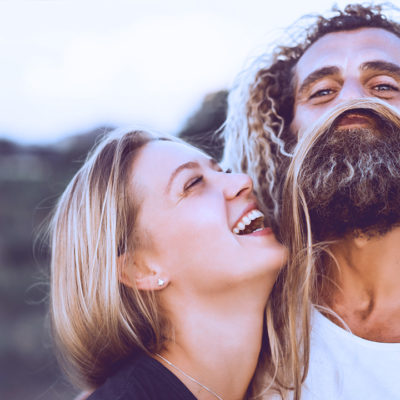 Couple laughing with hair making a beard.