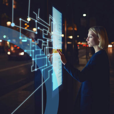 A woman explores a digital exhibit.