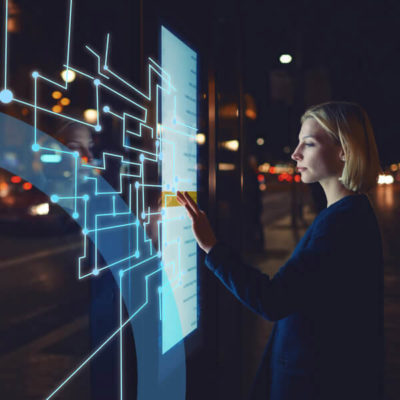 A woman explores a digital exhibit.