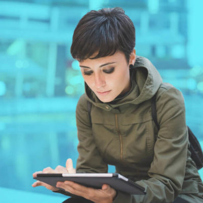 A woman uses a "near me" search on her tablet.