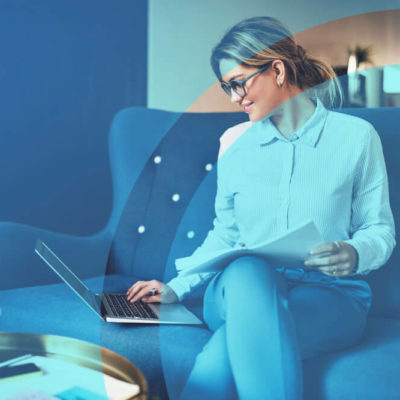 A woman works from home on her laptop.