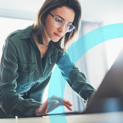 A woman works for her SMB on a laptop.