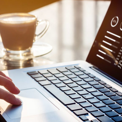 Person on the computer with coffee