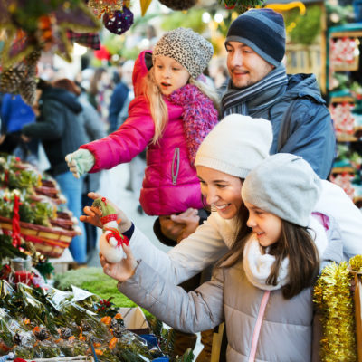 Family standing at coniferous souvenirs counter