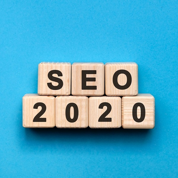 SEO 2020 text on wooden cubes on a blue background