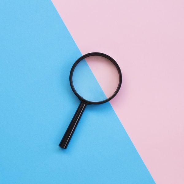 A colorful background with magnifying glass