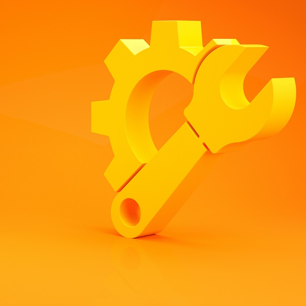 Yellow Wrench spanner and gear icon isolated on orange background.