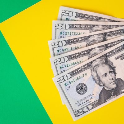 Cash Money on colorful background