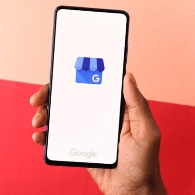 Google My Business logo on phone screen stock image.