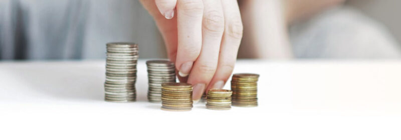 a woman stacking coins