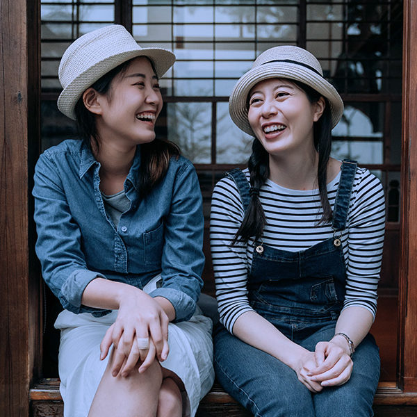 Two-Girls-Laughing-Hats- Two-Girls-Laughing-Hats-