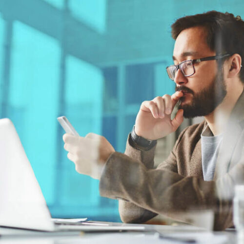 A man looks for leads virtually on his laptop.