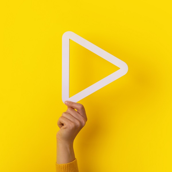 play button in hand play button in hand